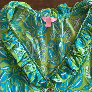 Size 8 Lilly Pulitzer blouse. Gold buttons and ruffle v neck.